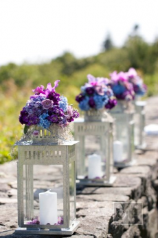 Candle lantern flower arrangements  - Our destination wedding