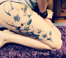 Thigh tattoo of flowers - Tattoo ideas