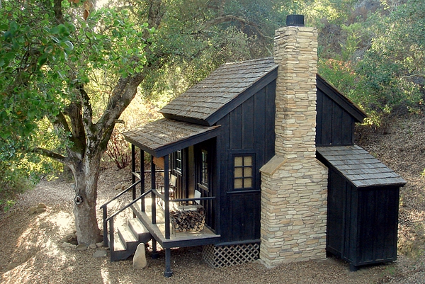 Small bunkie with front porch and stone fireplace