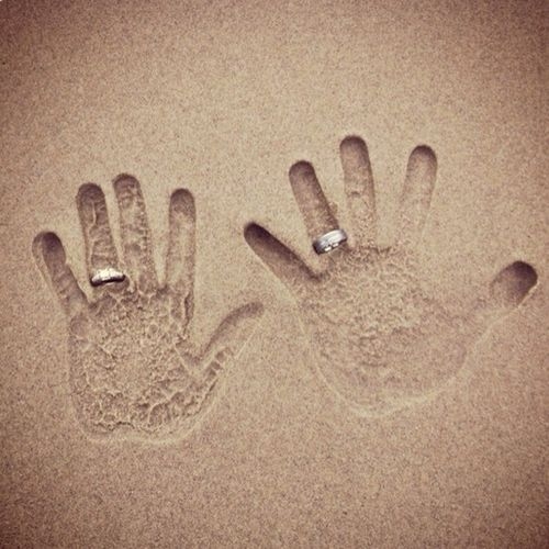 Hands in the sand
