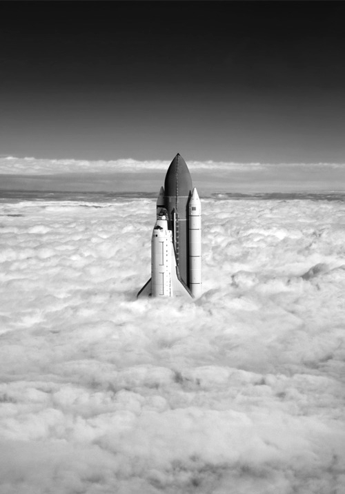 NASA Space Shuttle Breaching the Clouds