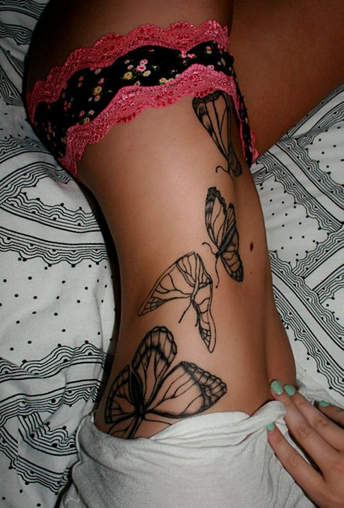 Side butterfly tattoo
