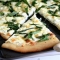 Four cheese white pizza with fresh basil, thyme & oregano - Food & Drink