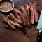Sliced medium rare flank steak