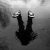 Cool photo of a person reflected on a wet surface - Black and White Photographic Portraits