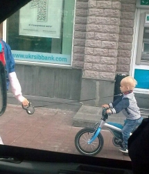 Child taken for a bike ride with dog collar and leash - Worst parents ever