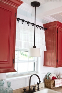 Tension rod between two cupboards - Home decoration