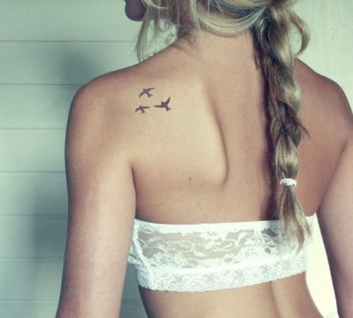 Birds on back tattoo