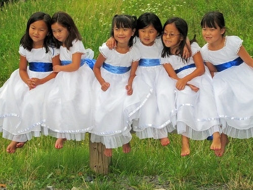 Girls in White Dresses With Blue Satin Sashes