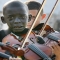 12 year old Brazilian playing the violin at his teacher’s funeral - Amazing photos