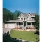 Country house plan with wraparound porch