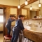 Large 3 spout bathroom sink resting on timber beams