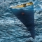 Racing yacht casting a shadow [photo] - Beautiful ocean