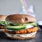 Smoky Sweet Potato Burgers with Roasted Garlic Cream and Avocado.