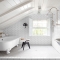 White attic bathroom with pedestal tub  - Attic Space